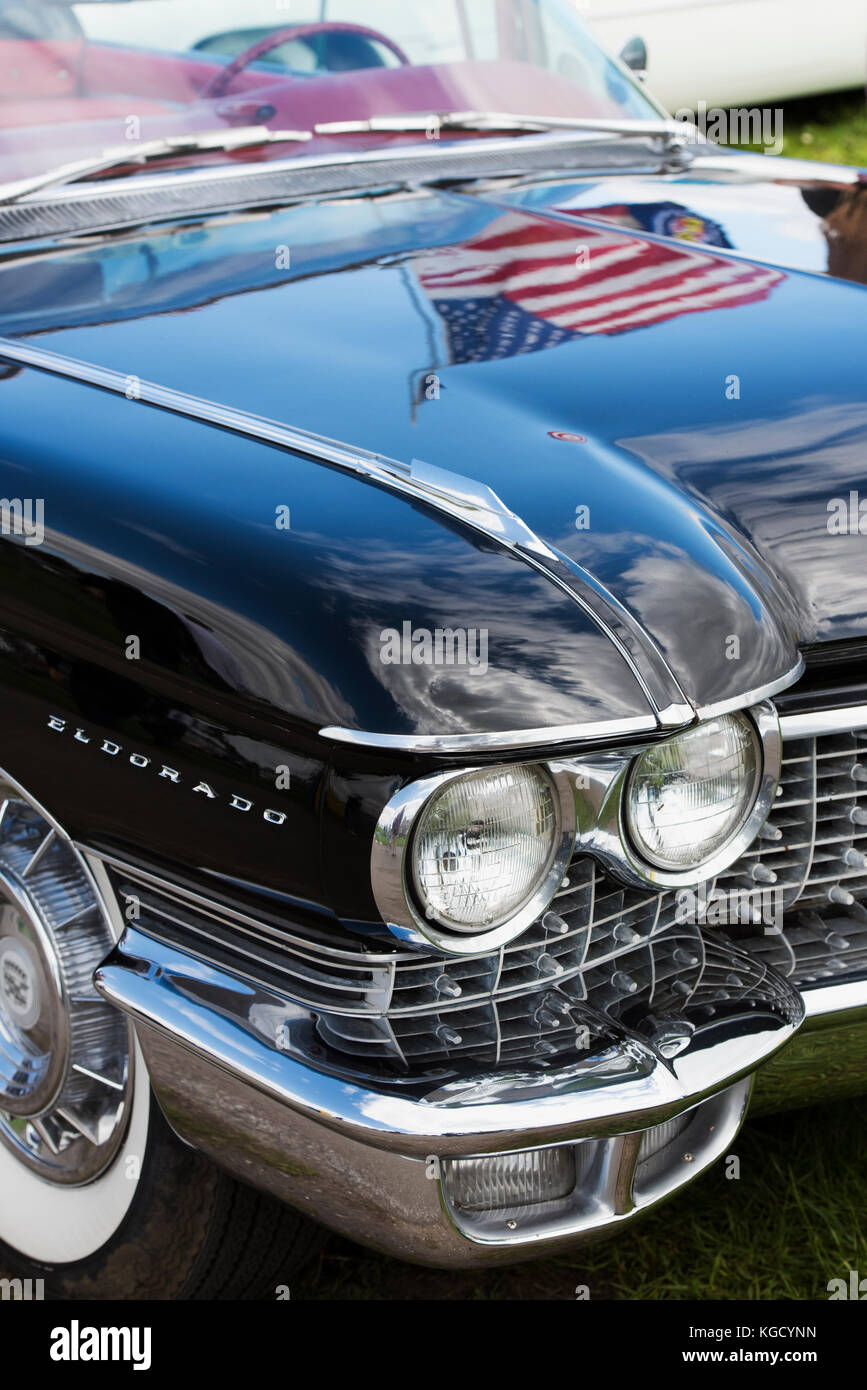 1960 Cadillac Eldorado Convertible car with an american flag reflected in the bonnet. UK Stock Photo