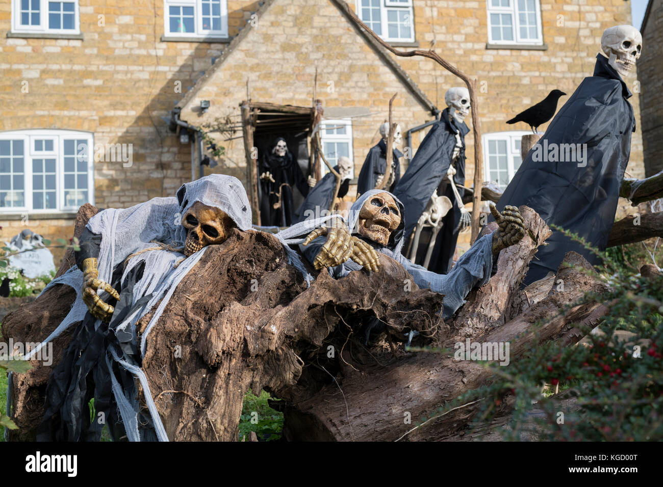 Halloween skeletons and grim reaper outside a house in Snowshill, Cotswolds, Gloucestershire, England Stock Photo