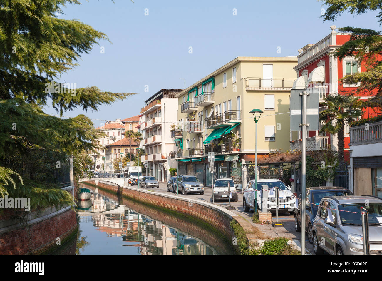 Via Lepanto and a tranquil canal, Lido di Venezia, Lido , Venice, Italy  in autumn sunshine Stock Photo