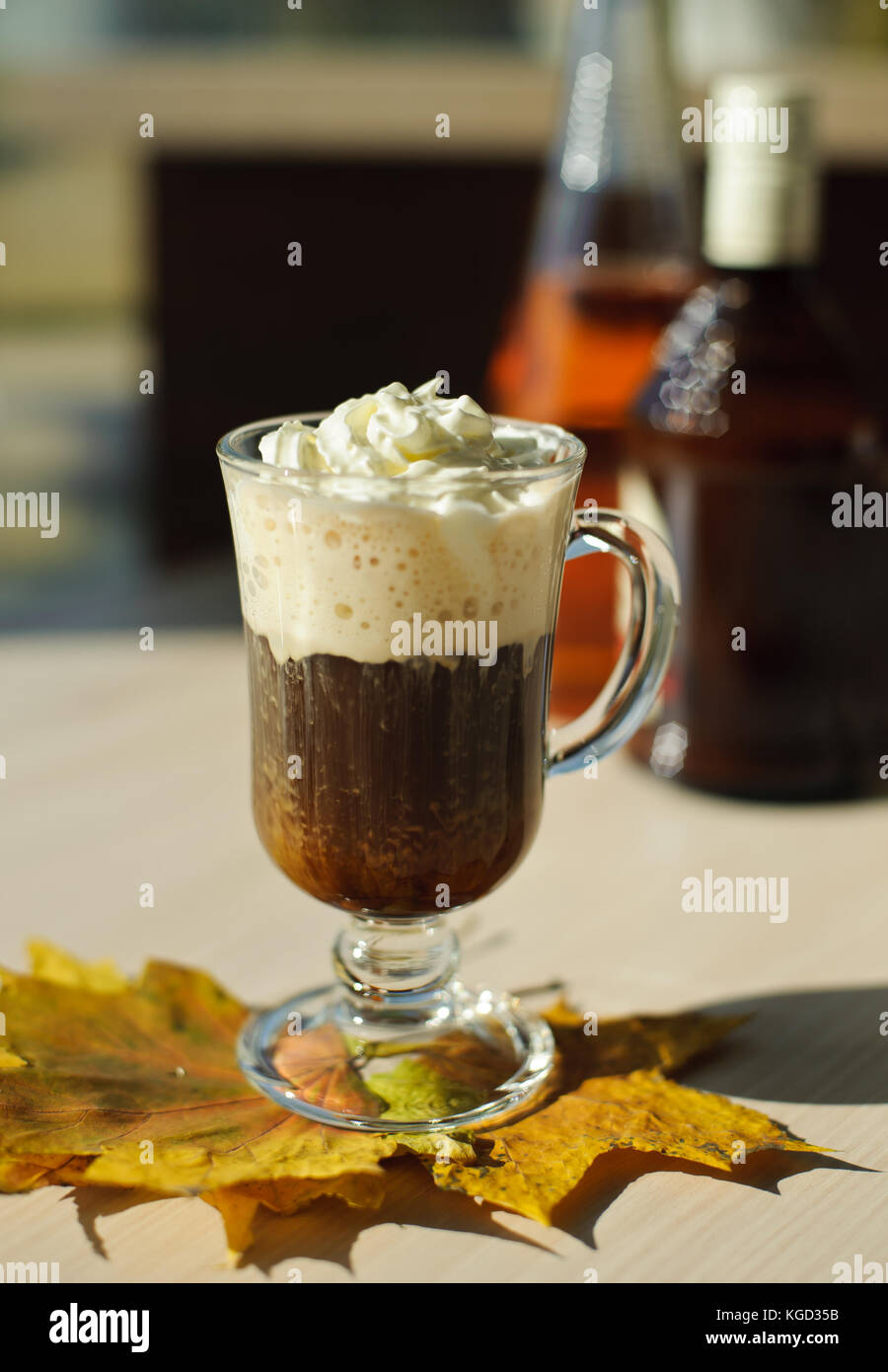 cup of coffee with whipped cream on the table with leaves Stock Photo ...