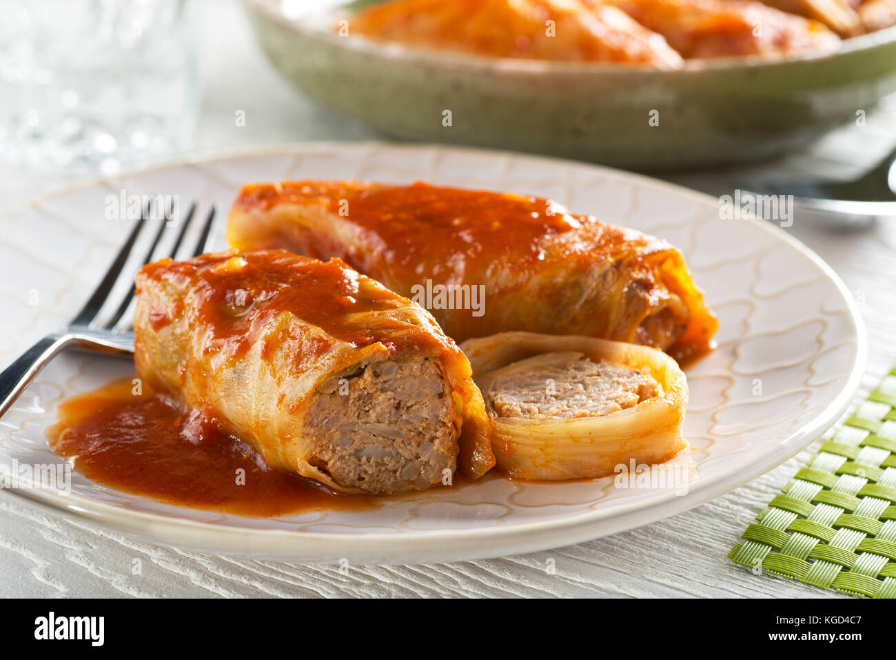 Delicious homemade cabbage rolls with ground pork, rice, and tomato sauce. Stock Photo