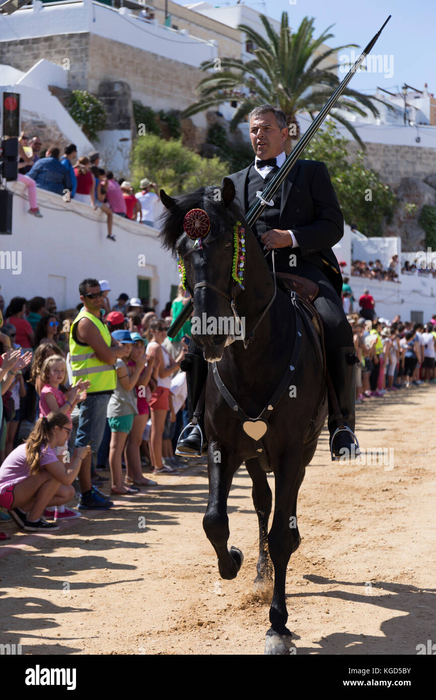 A man riding a horse dressed up in traditional costume in Saint John's  festival in Menorca Stock Photo - Alamy