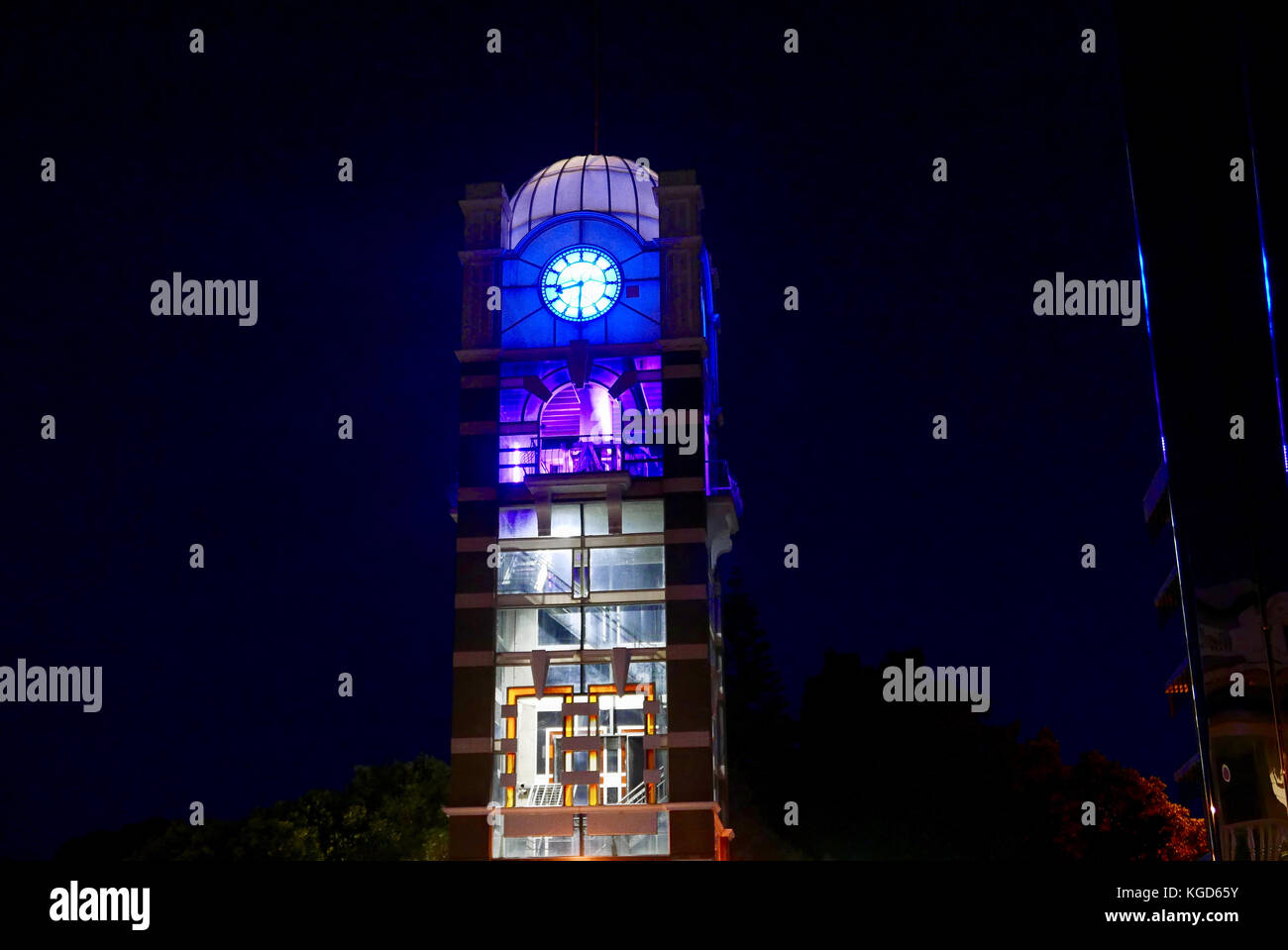 Clock tower illuminated at night Stock Photo Alamy