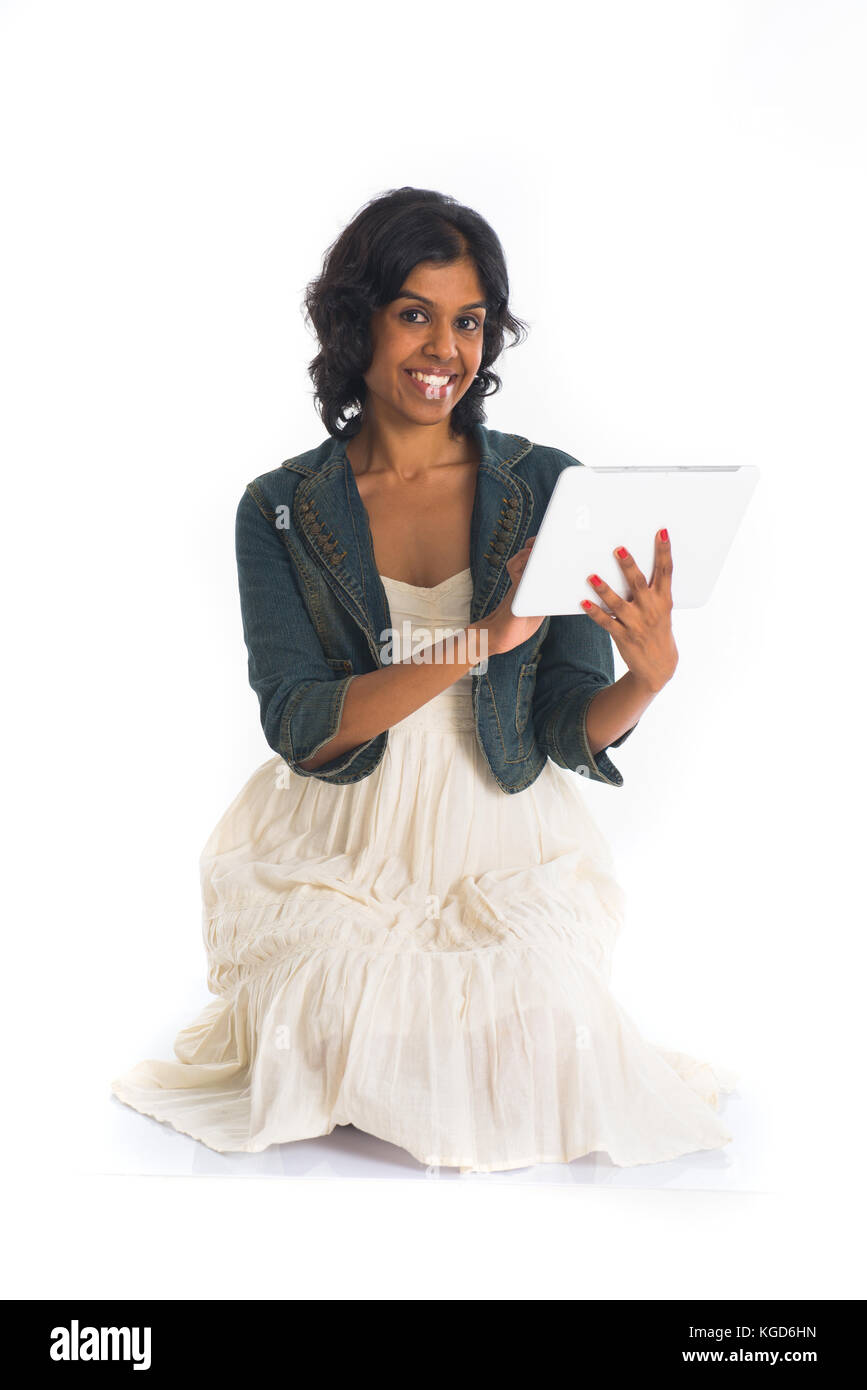 indian teenage girl using tablet Stock Photo