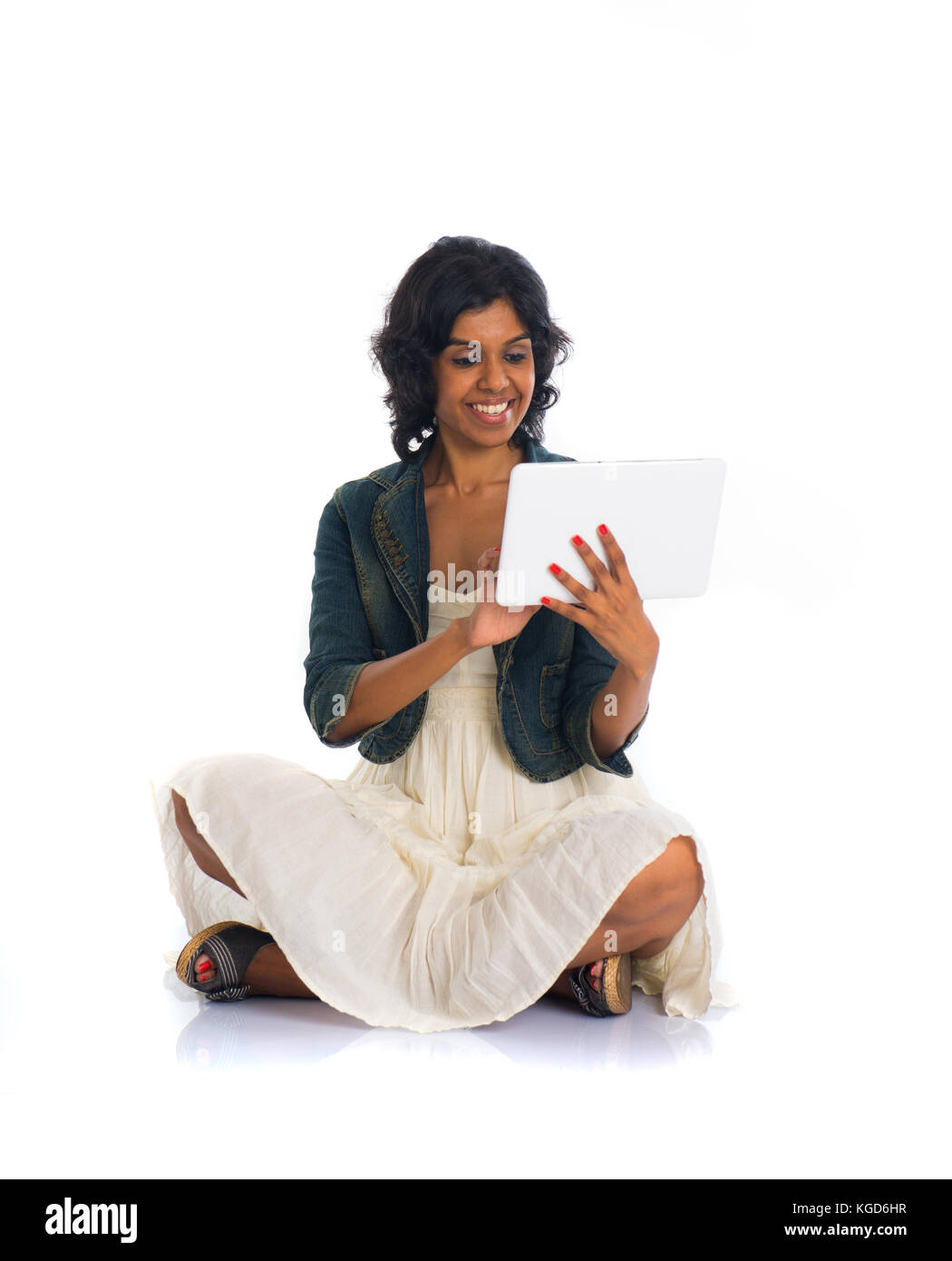 indian teenage girl using tablet Stock Photo