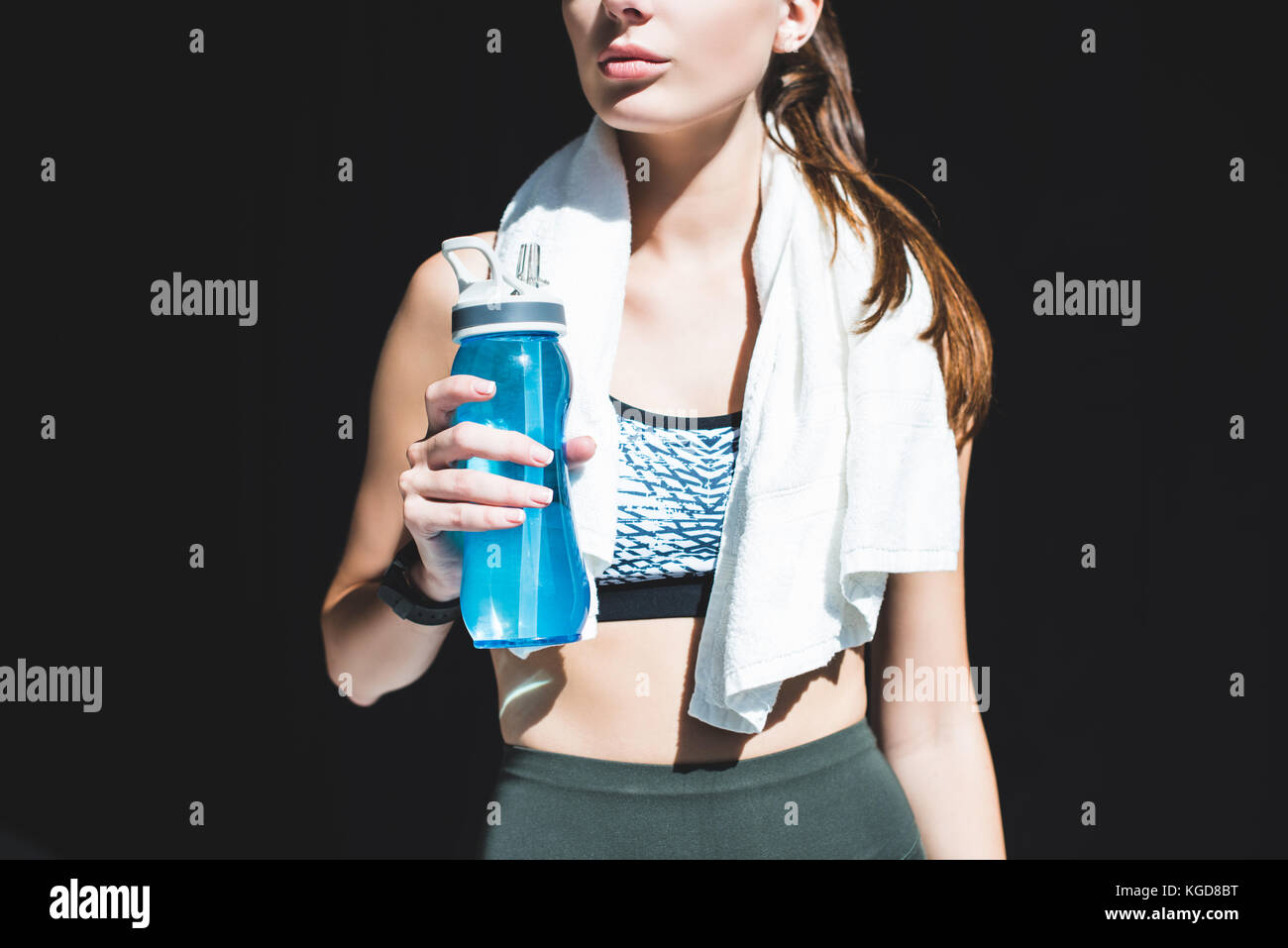 sportswoman with towel and bottle of water Stock Photo - Alamy