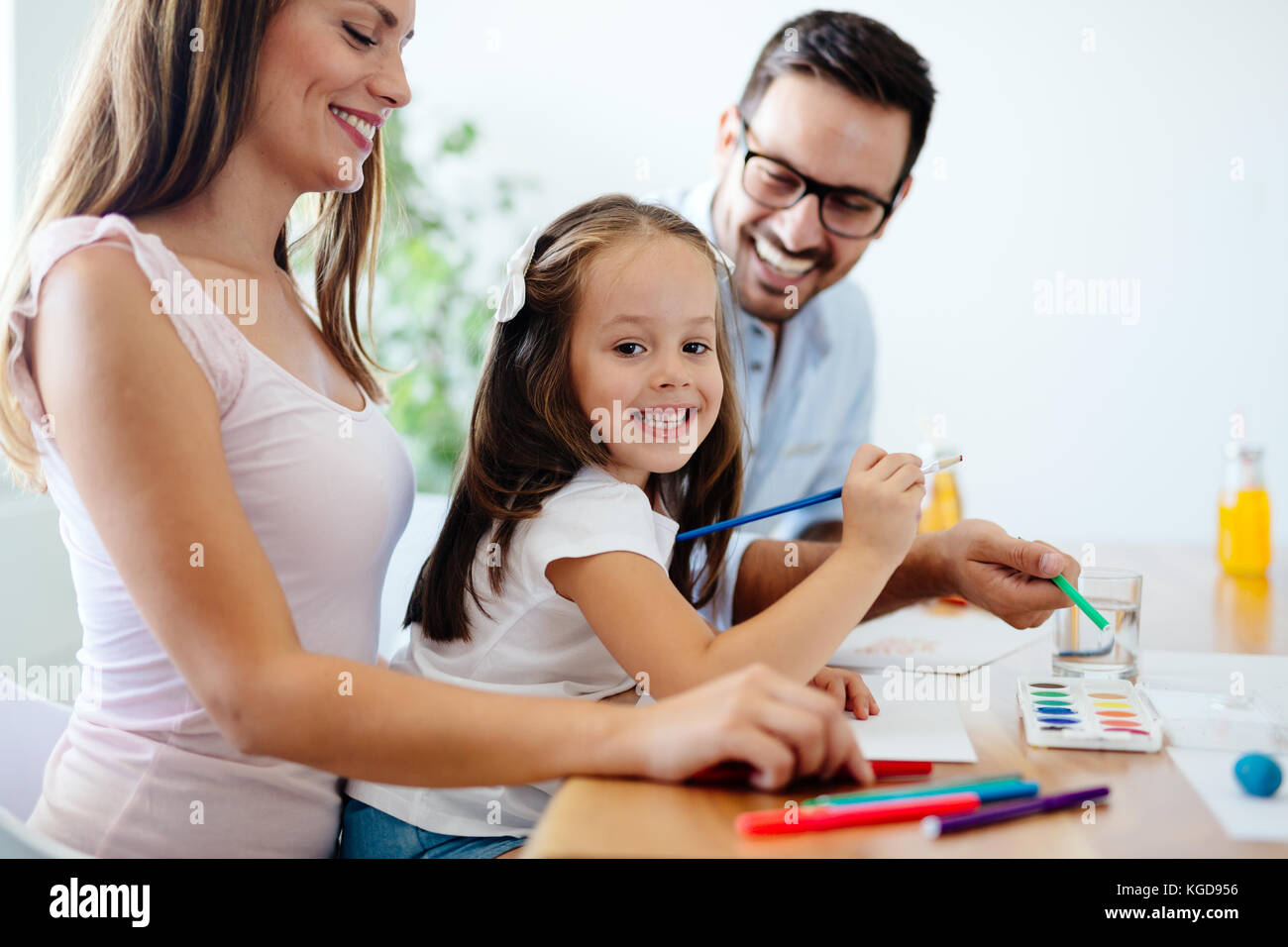 Happy girl drawing home hi-res stock photography and images - Alamy