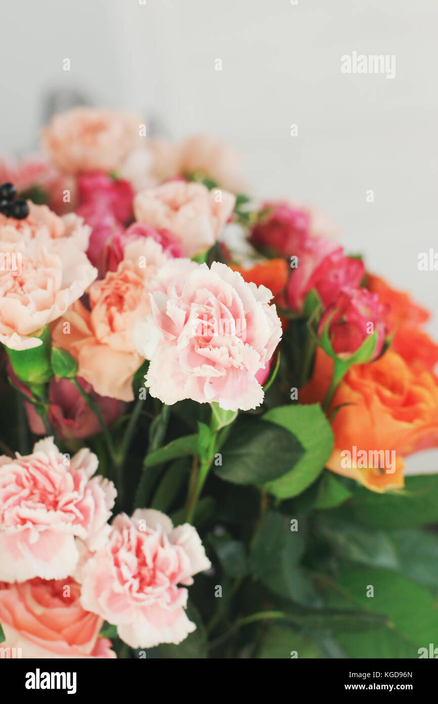 The roses and carnations backgrounds. Copy space Stock Photo - Alamy