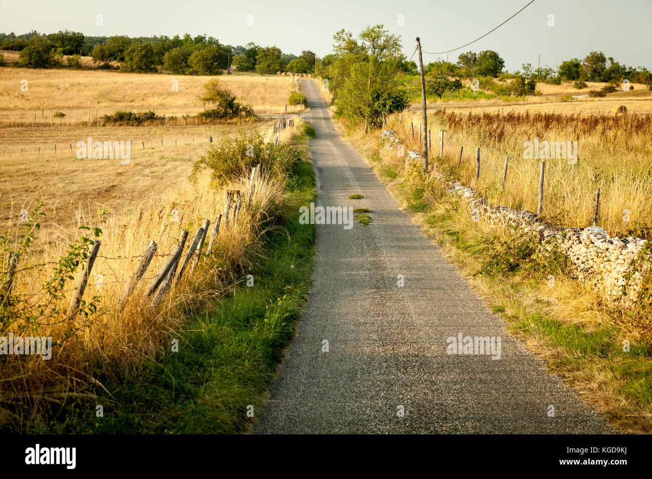 A country road disappears into the distance in Cahors, France Stock Photo