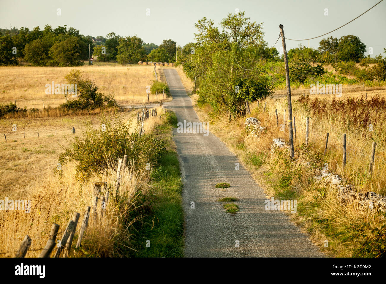A country road disappears into the distance in Cahors, France Stock Photo