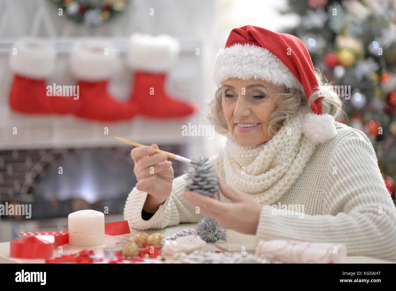 Senior woman in Santa hat Stock Photo - Alamy