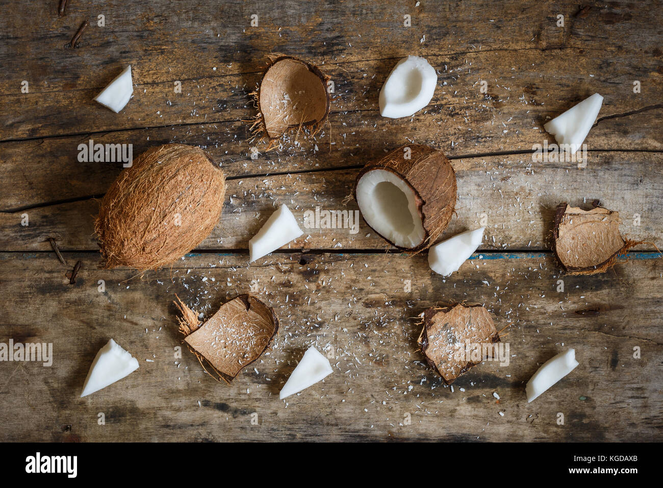 Fresh coconuts with spreaded chops, meat, flakes and shell parts on