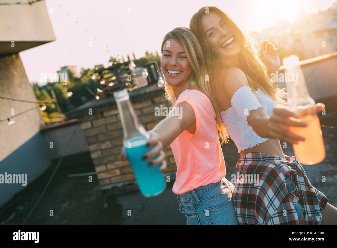 Happy young girls having fun at party Stock Photo - Alamy