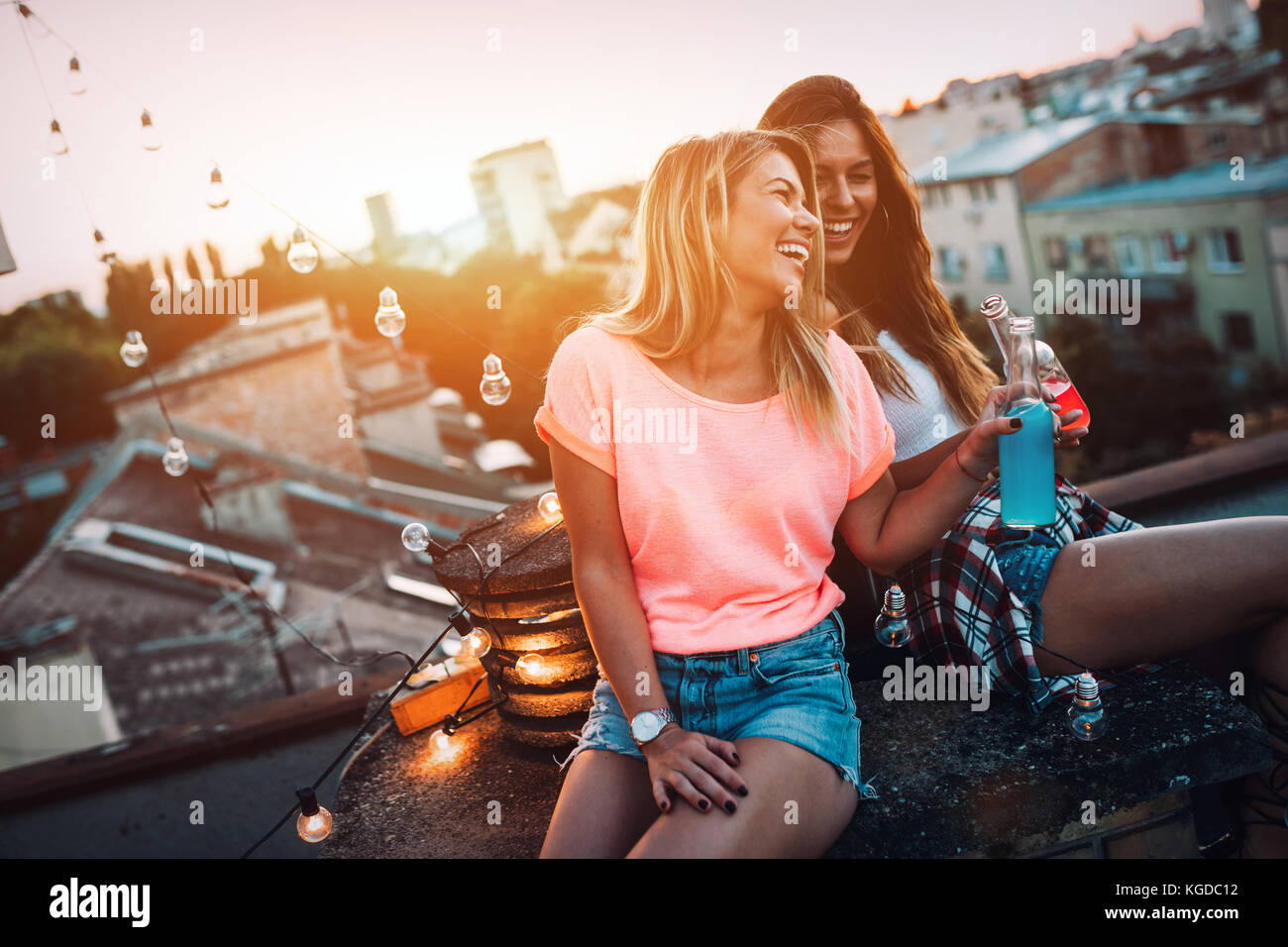 Happy young girls having fun at party Stock Photo