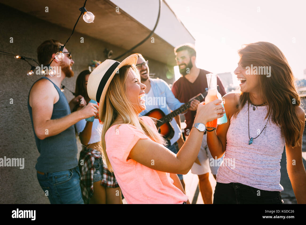 Happy young girls having fun at party Stock Photo - Alamy