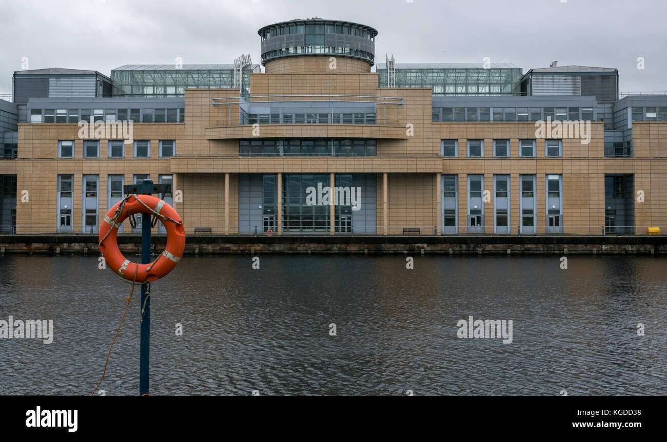 Victoria Quay, Scottish Government office building, Leith, Edinburgh, UK, with lifebelt in foreground Stock Photo