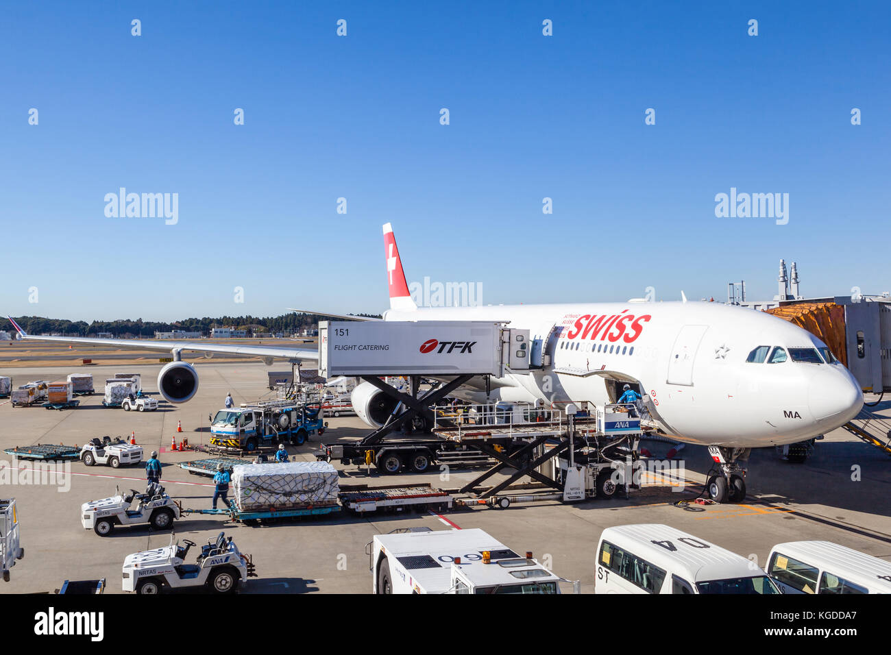 TOKYO, JAPAN - DEC. 5, 2014: A Swiss International Air Lines plane being serviced on the tarmac of Tokyo Narita Airport. The airline was formed after  Stock Photo