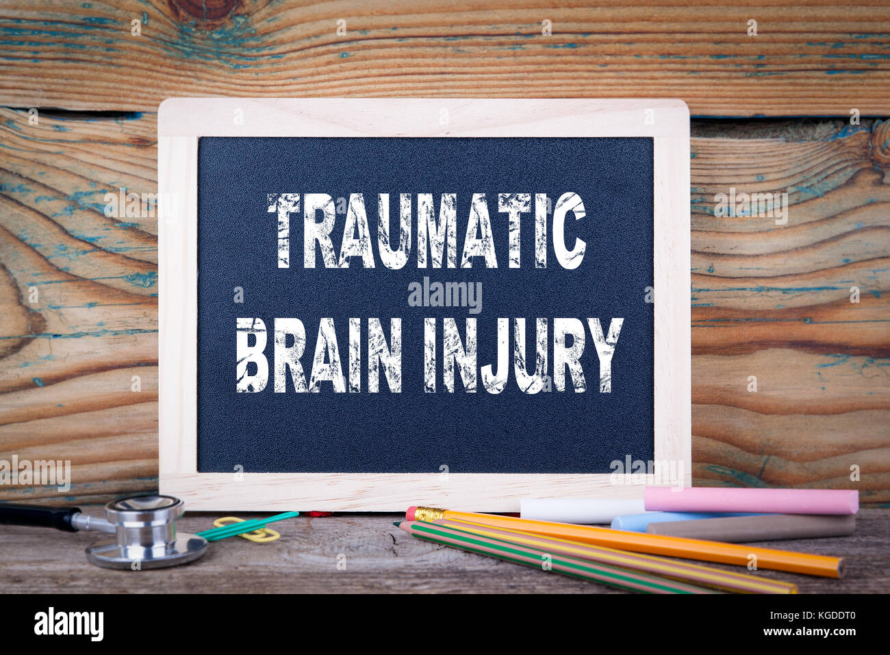 traumatic brain injury. Chalkboard on a wooden background Stock Photo