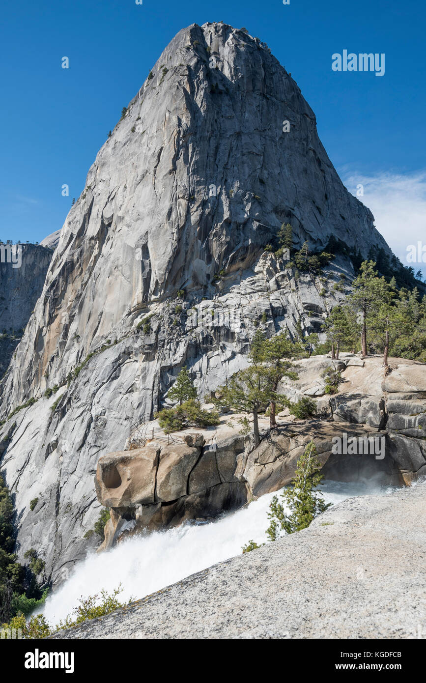 A side view of half dome from a hiking trail in Yosemite National Park. Stock Photo