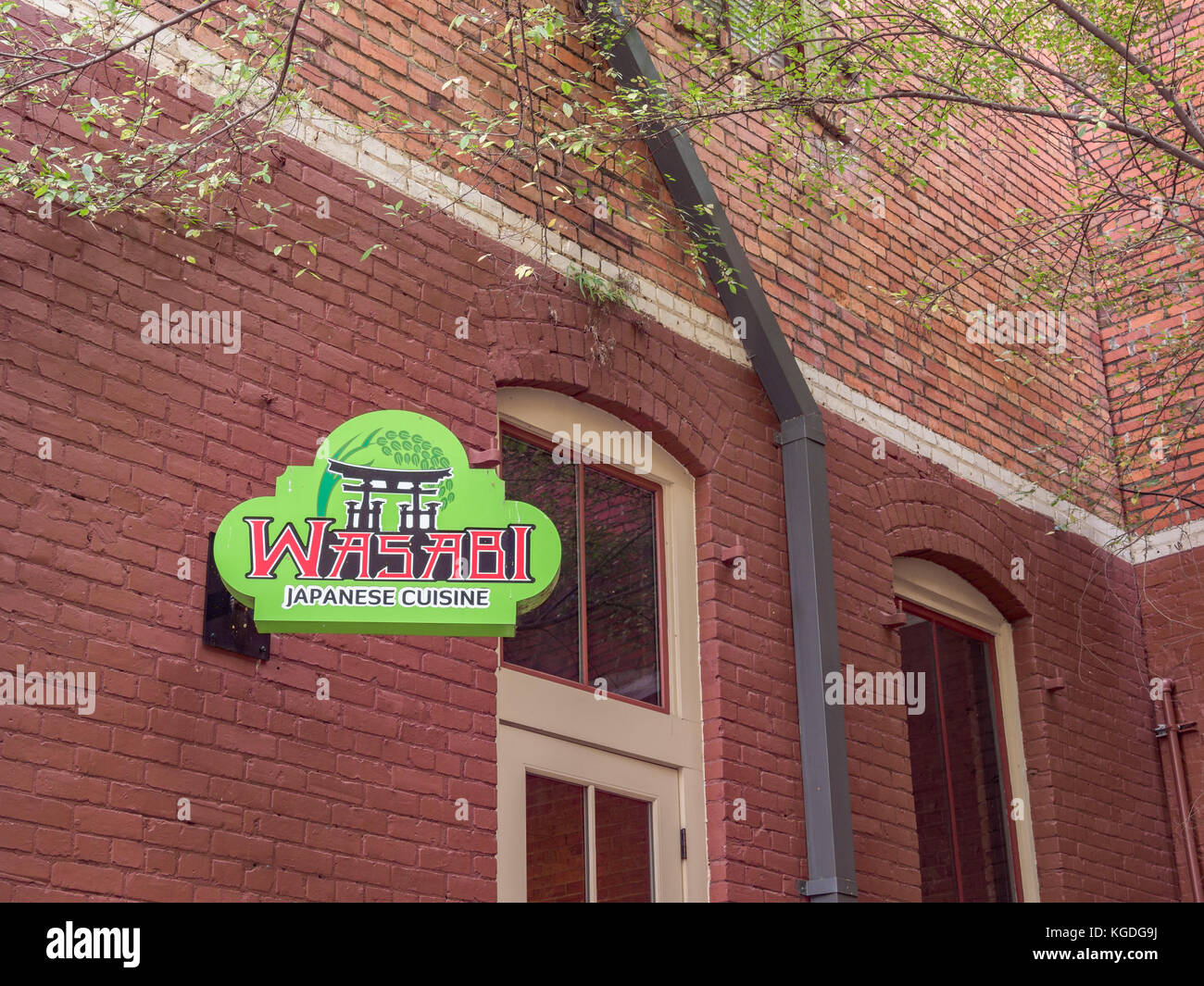 Green sign for Wasabi Japanese Cuisine restaurant in the popular urban space called The Alley, in Montgomery, Alabama USA. Stock Photo
