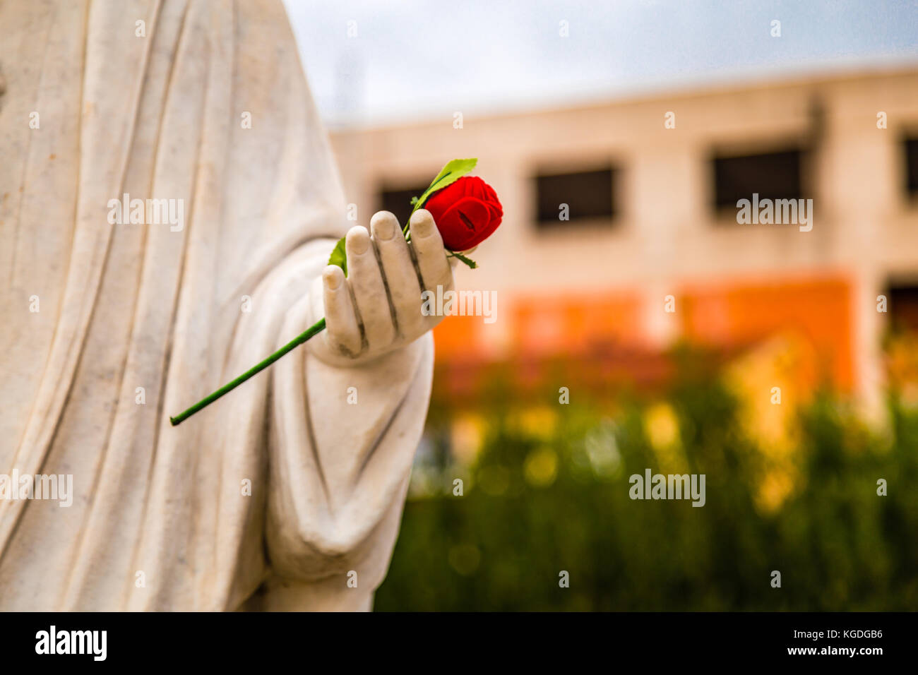 statue of Our Lady of Medjugorje, the Blessed Virgin Mary, with red