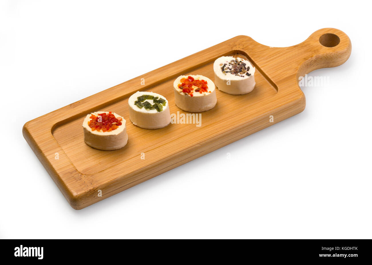 Cheese platter garnished  on rustic wooden board with clipping path Stock Photo