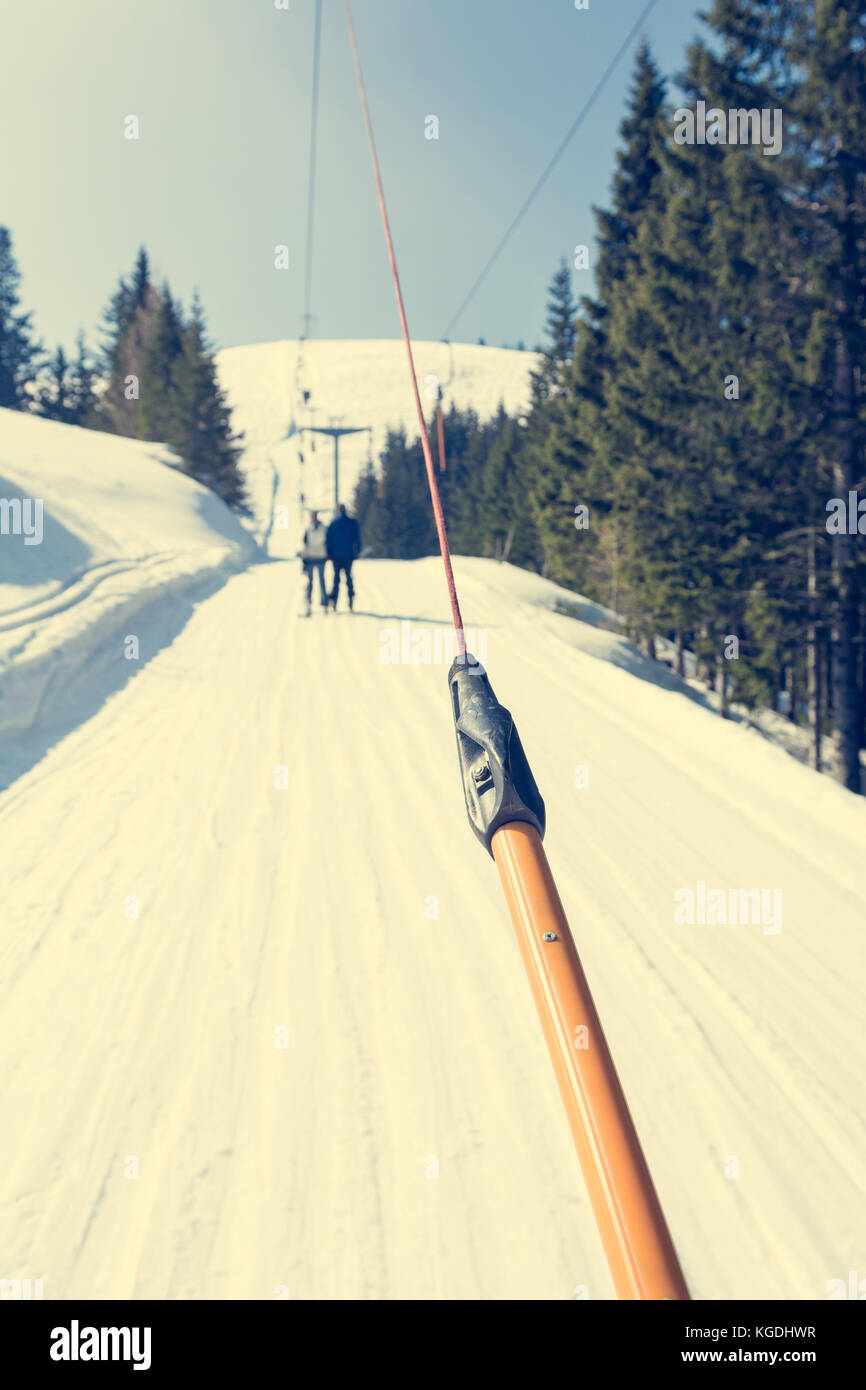 Riding a button ski lift point of view Stock Photo Alamy