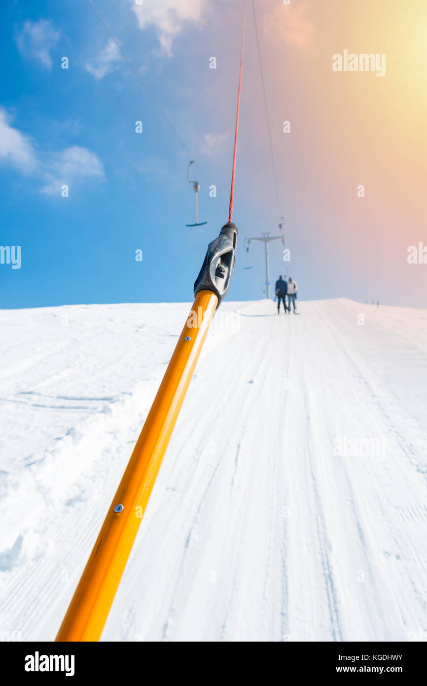 Riding a button ski lift point of view Stock Photo Alamy