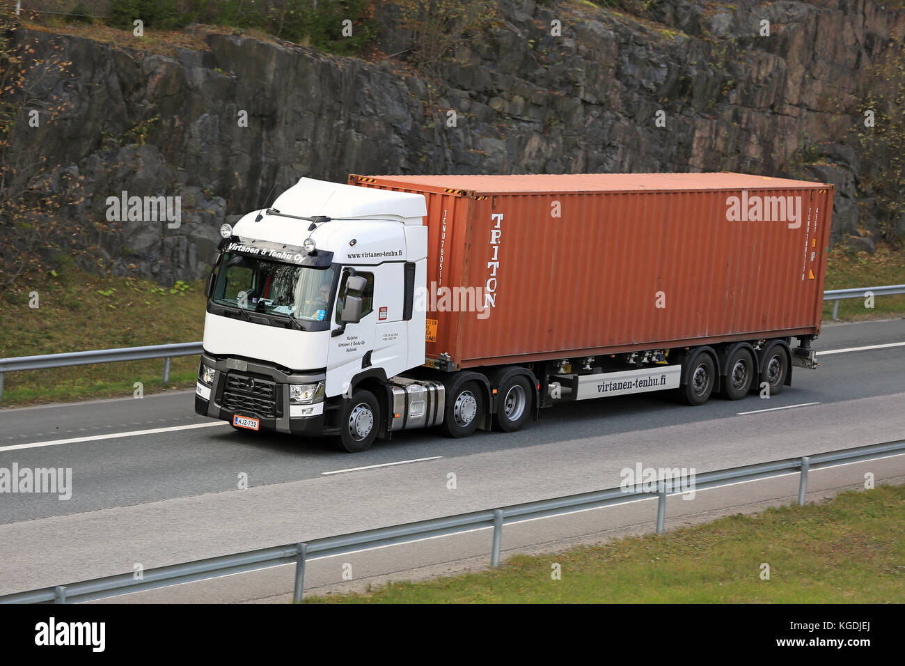 RIIHIMAKI, FINLAND - OCTOBER 10, 2015: White Renault Trucks T hauls an intermodal container. Approx. 90% of all goods are transported in containers. Stock Photo