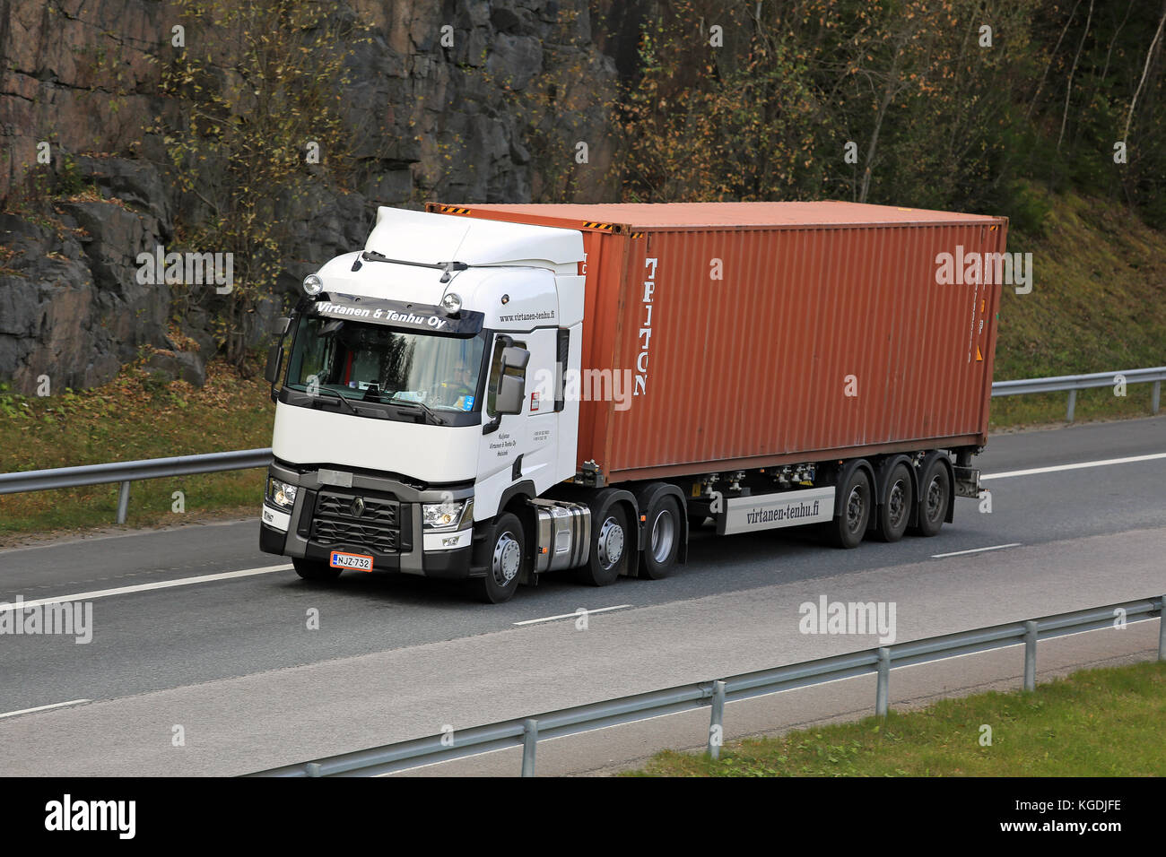 RIIHIMAKI, FINLAND – OCTOBER 10, 2015: White Renault Trucks T hauls an intermodal container. Approx. 90% of all goods are transported in containers. Stock Photo