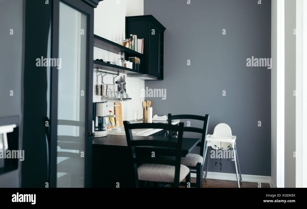 Modern kitchen with black table and chairs Stock Photo Alamy