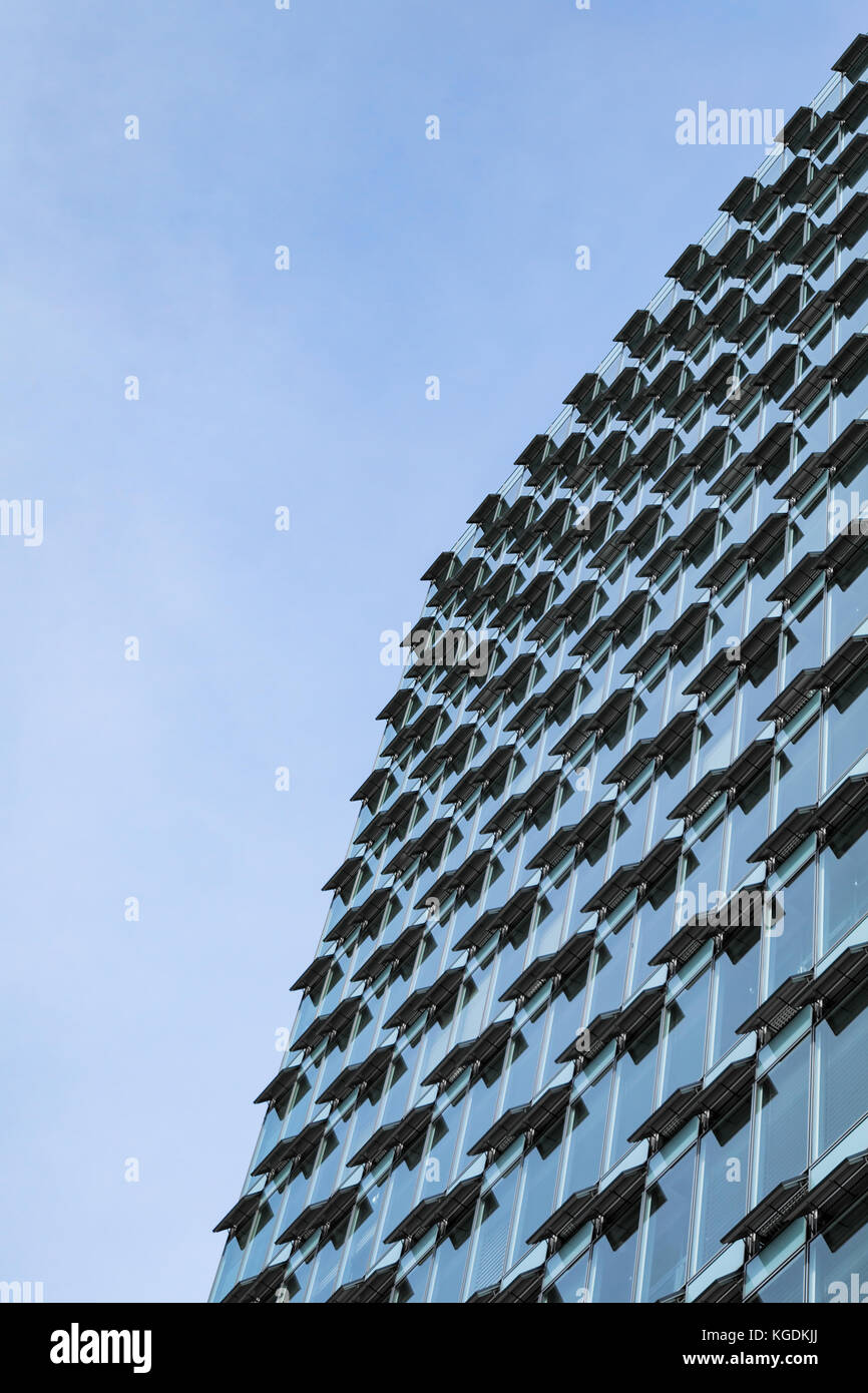 Glass and steel modern highrise office building with open ventilation system in hot day Stock