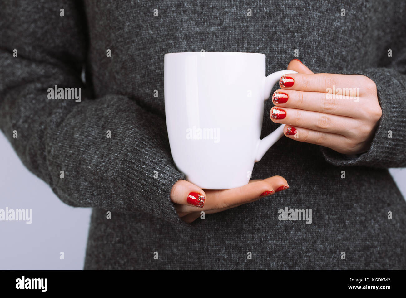 Woman holds white coffee cup Stock Photo Alamy