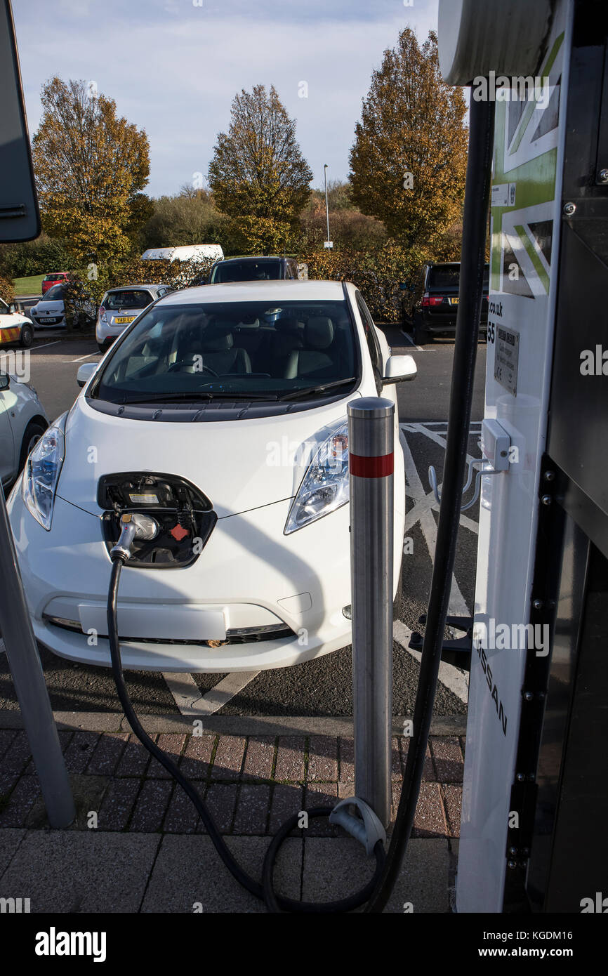 Nissan Leaf Electric Car at a recharging point at a Motorway Service Station Stock Photo