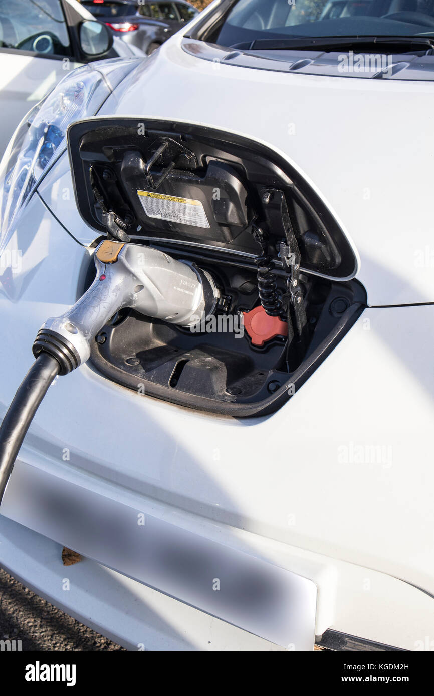 Nissan Leaf Electric Car at a recharging point at a Motorway Service Station Stock Photo