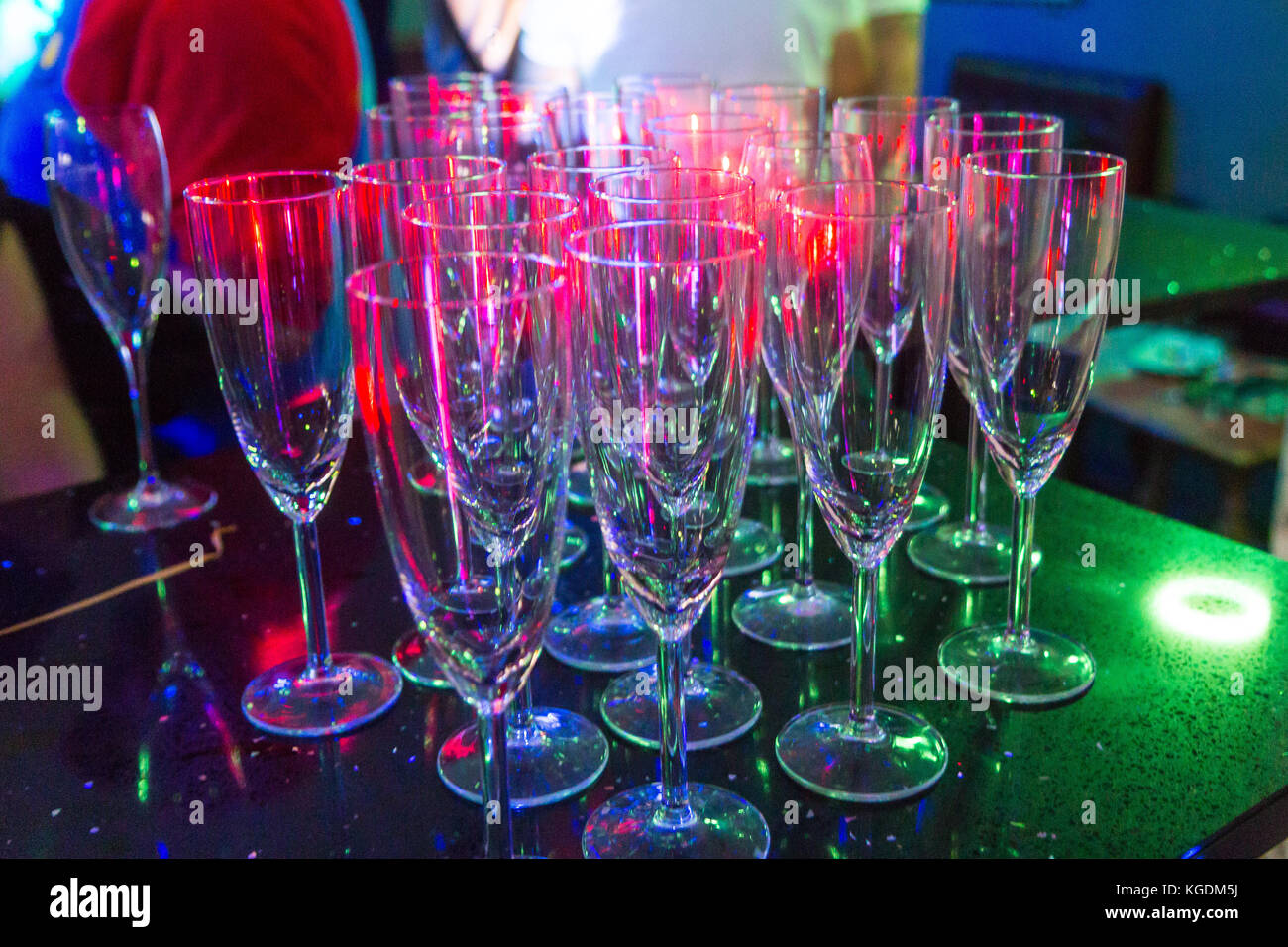 Empty glasses in colourful light Stock Photo