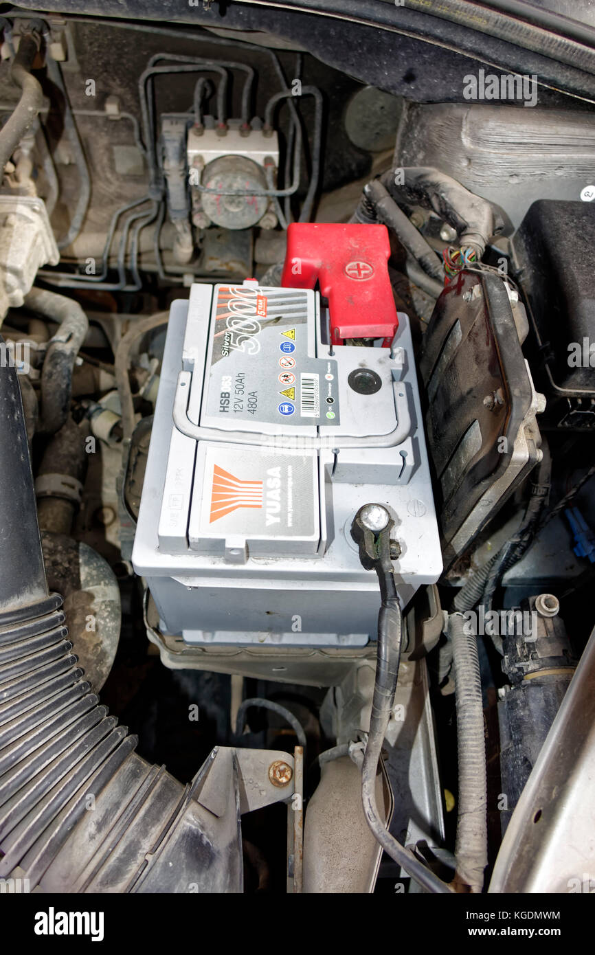 A Yuasa car battery in the engine bay of a 2006 Suzuki SX4 Stock Photo