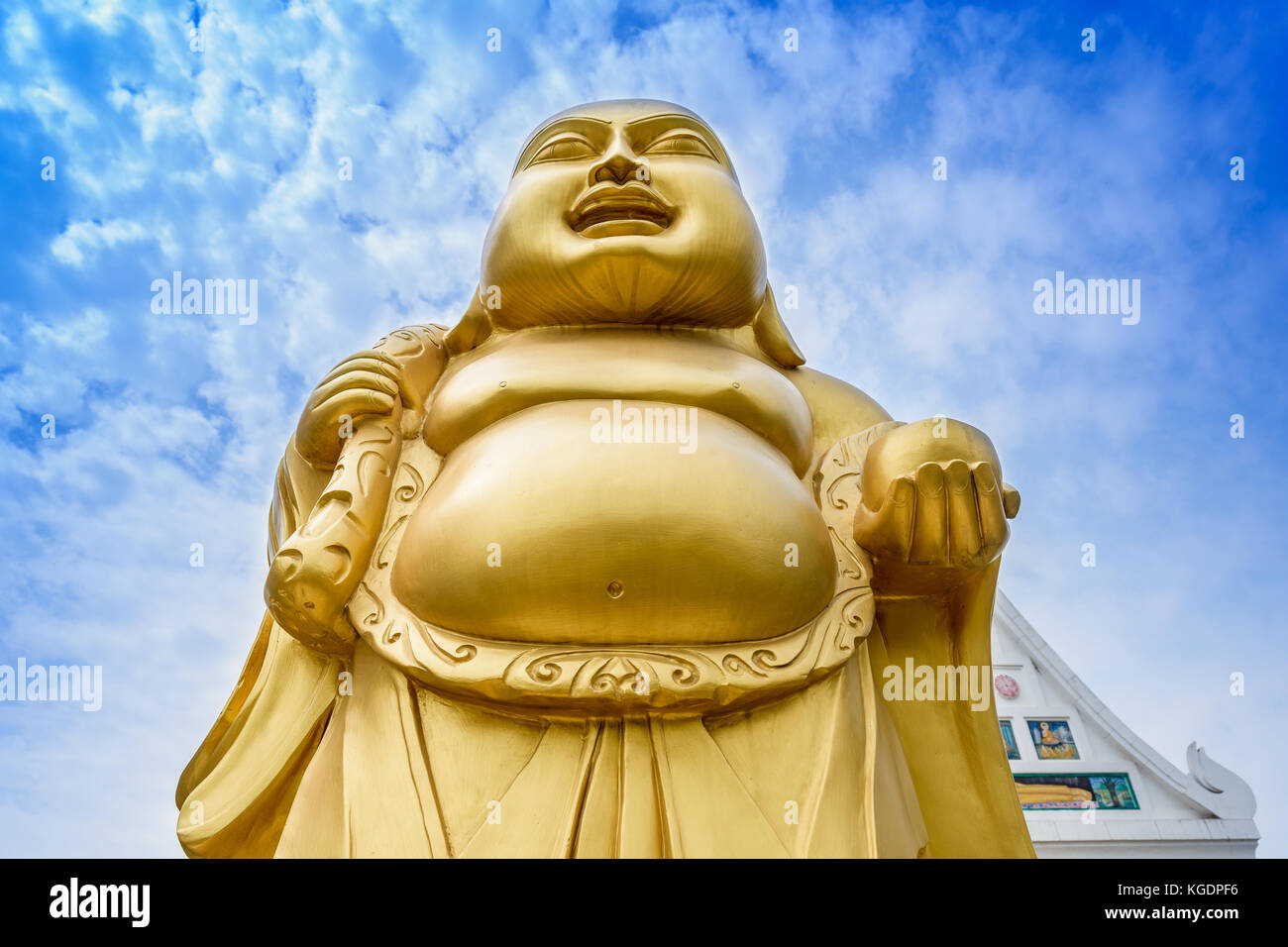 Laughing Buddha statue at a Buddhist monastery at Sarnath, Varanasi, India. Stock Photo