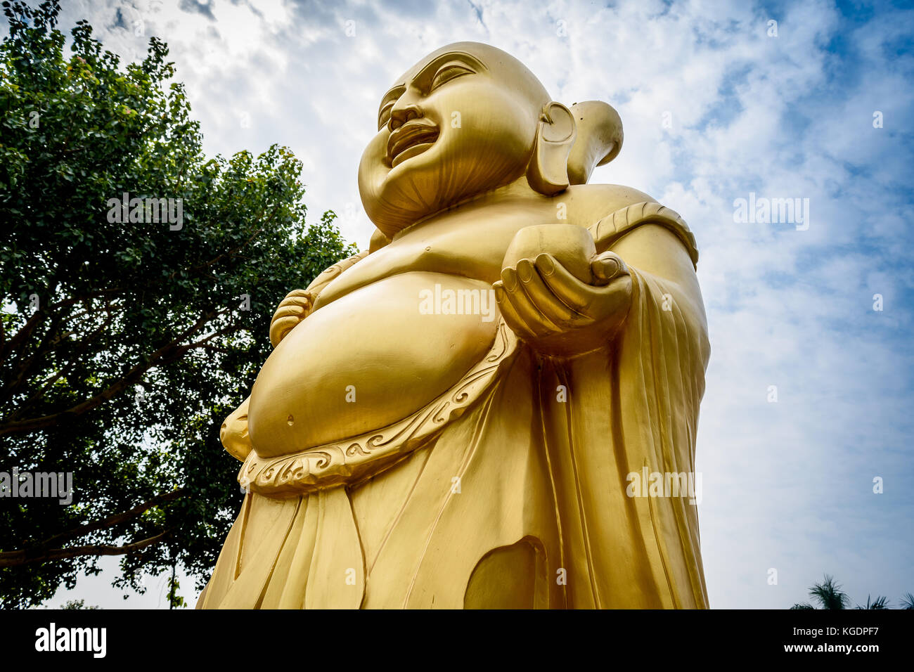 Laughing Buddha statue at a Buddhist monastery at Sarnath, Varanasi, India. Stock Photo