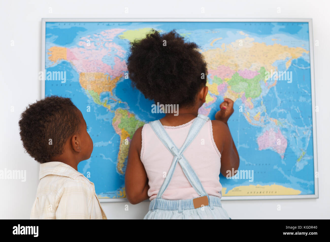 African american preschoolers in the classroom with world map Stock Photo
