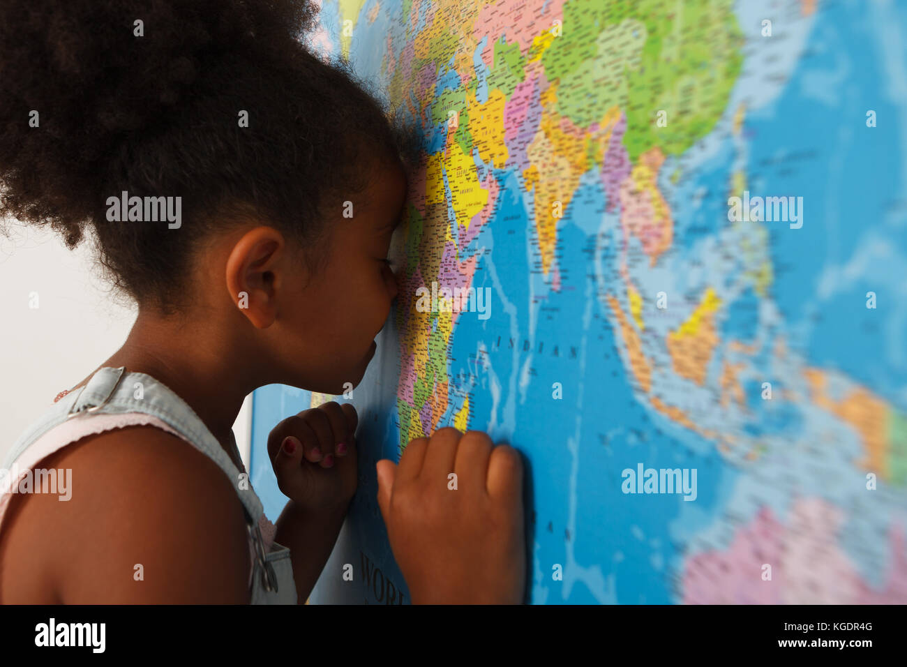 African american preschool girl near the map Stock Photo