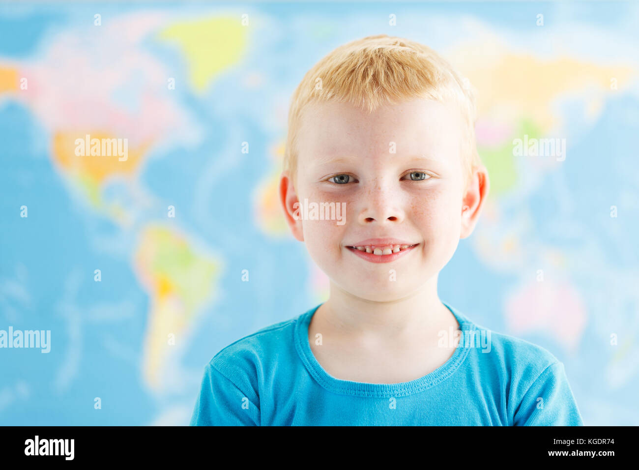 Happy preschooler in a classroom of geography Stock Photo