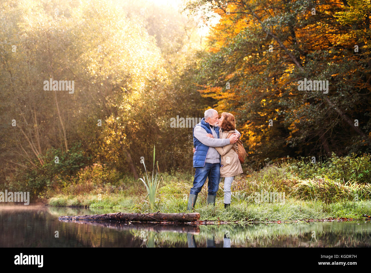 Senior couple on a walk in autumn nature Stock Photo - Alamy