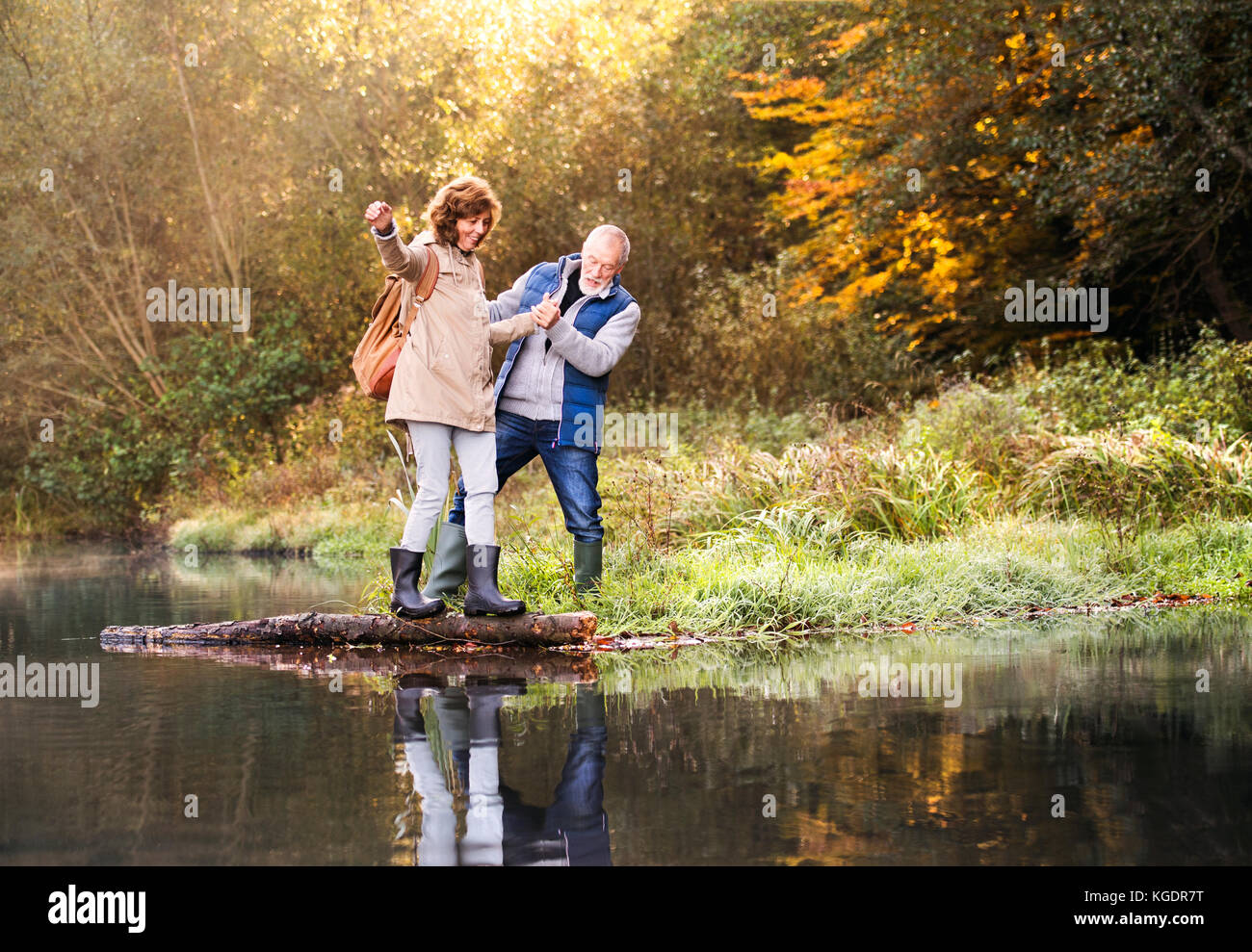 Senior couple on a walk in autumn nature Stock Photo - Alamy
