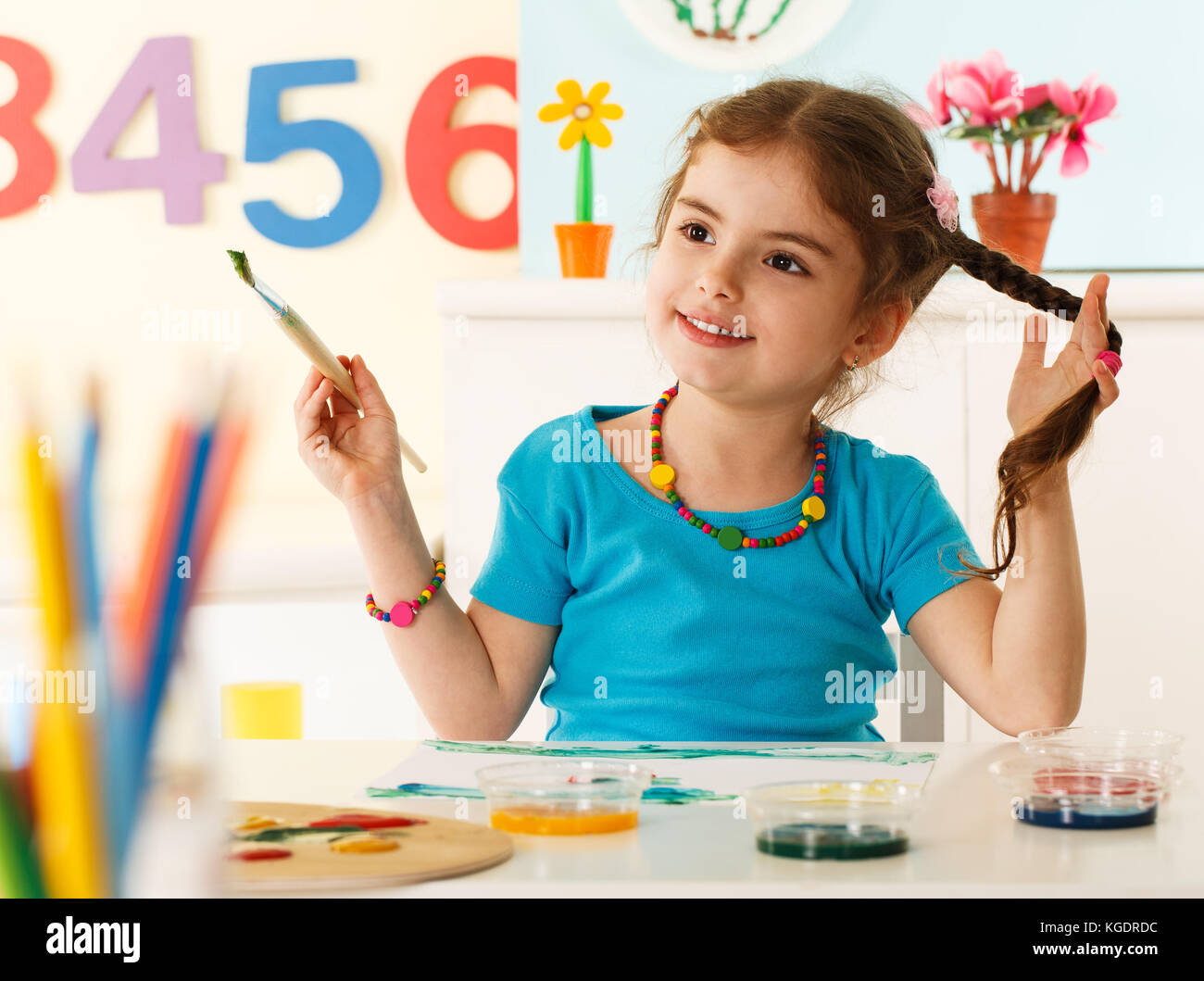 Preschool girl drawing Stock Photo