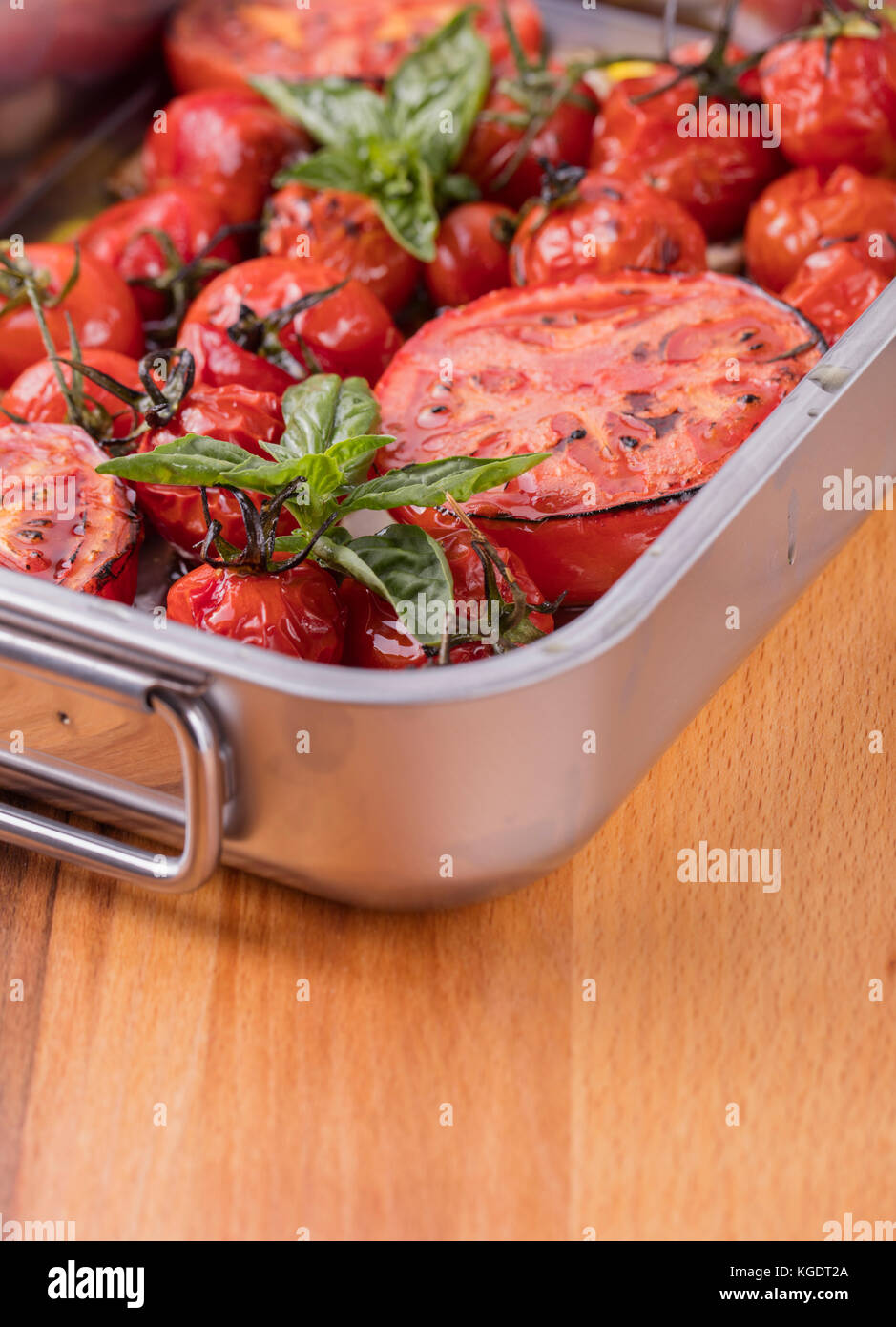 baked tomatoes in the oven ready for eating Stock Photo Alamy
