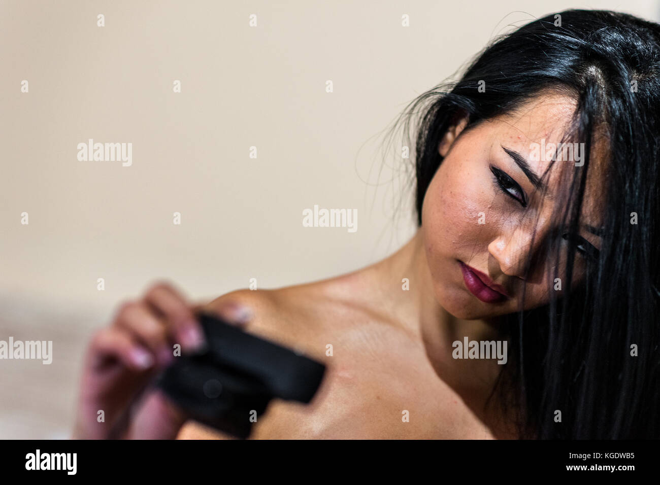 A Colombian webcam model, known as Taylor Cox, engages her online viewers with sensual look