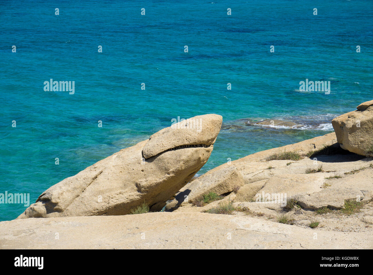 Rock shows shape of a shark, beach of Agia Anna, west side of Naxos island, Cyclades, Aegean, Greece Stock Photo