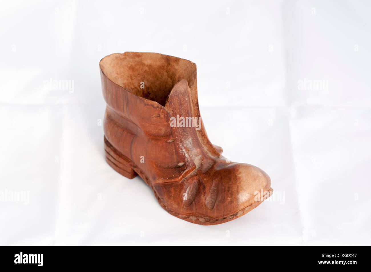Hand crafted Wooden old boot on white background Stock Photo Alamy
