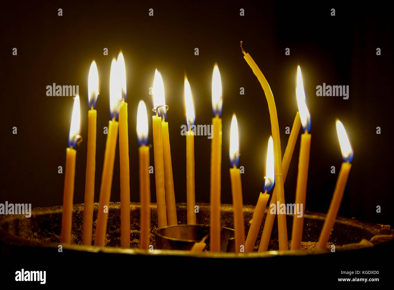 Lit candles in a Catholic Church. Photographed in Crete, GREECE Stock